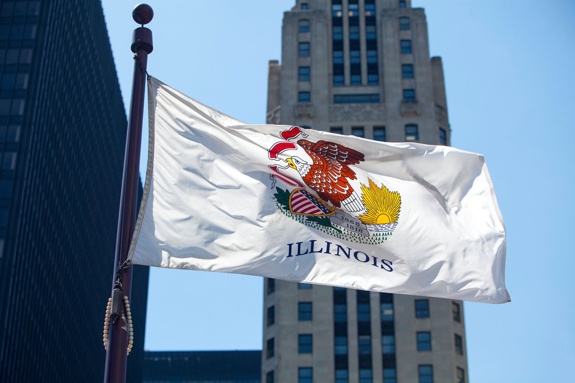 Illinois Flag - Compliance deadlines for Illinois Equal Pay Act amendments approaching 